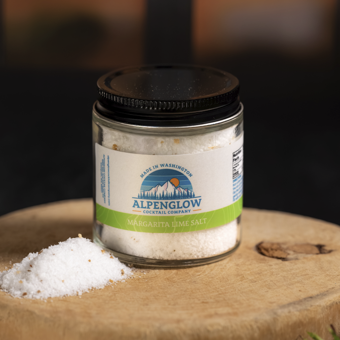 Jar of Alpenglow product on a wooden surface with a blurred natural background