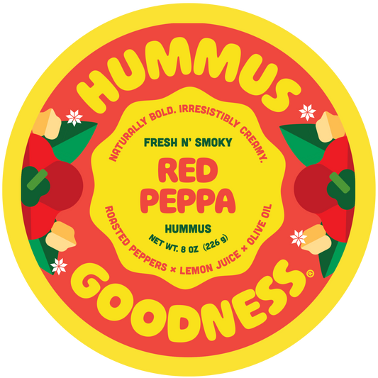 Hummus container with red and yellow design featuring roasted peppers and lemon juice.