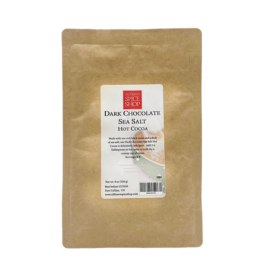 Brown package of Dark Chocolate Sea Salt Hot Cocoa with a label on a white background