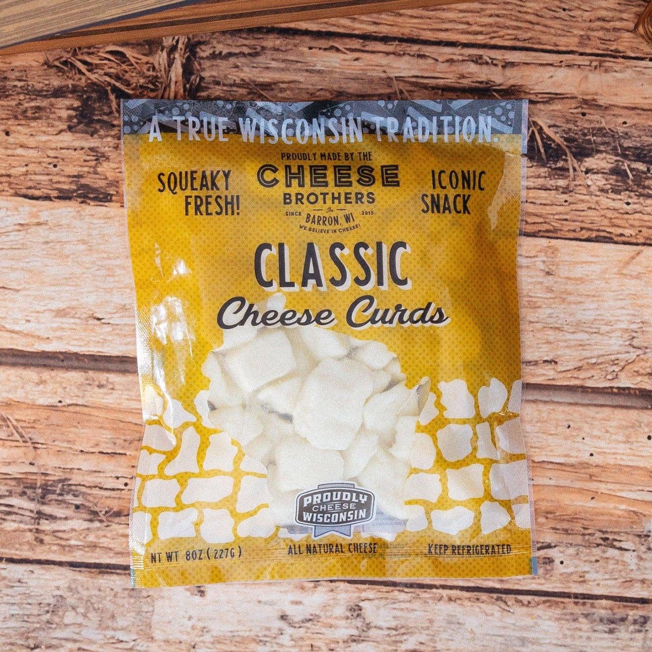Package of Classic Cheese Curds on a wooden surface